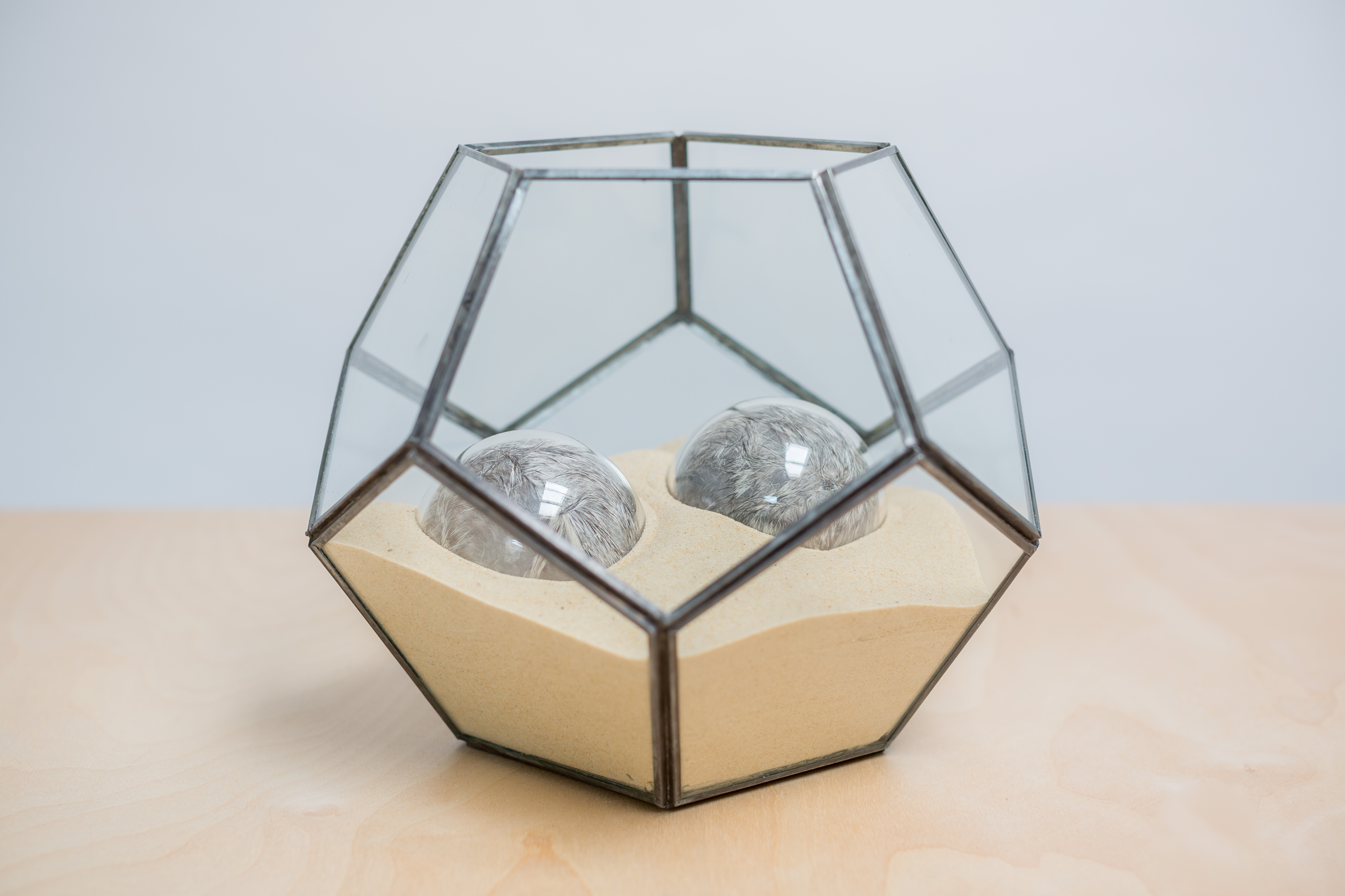 Adeline de Monseignat, Twins in Womb (1) 2013, Two 8cm diameter glass spheres on bed of sand inside vintage terrarium, 21 x 21 x 21 cm