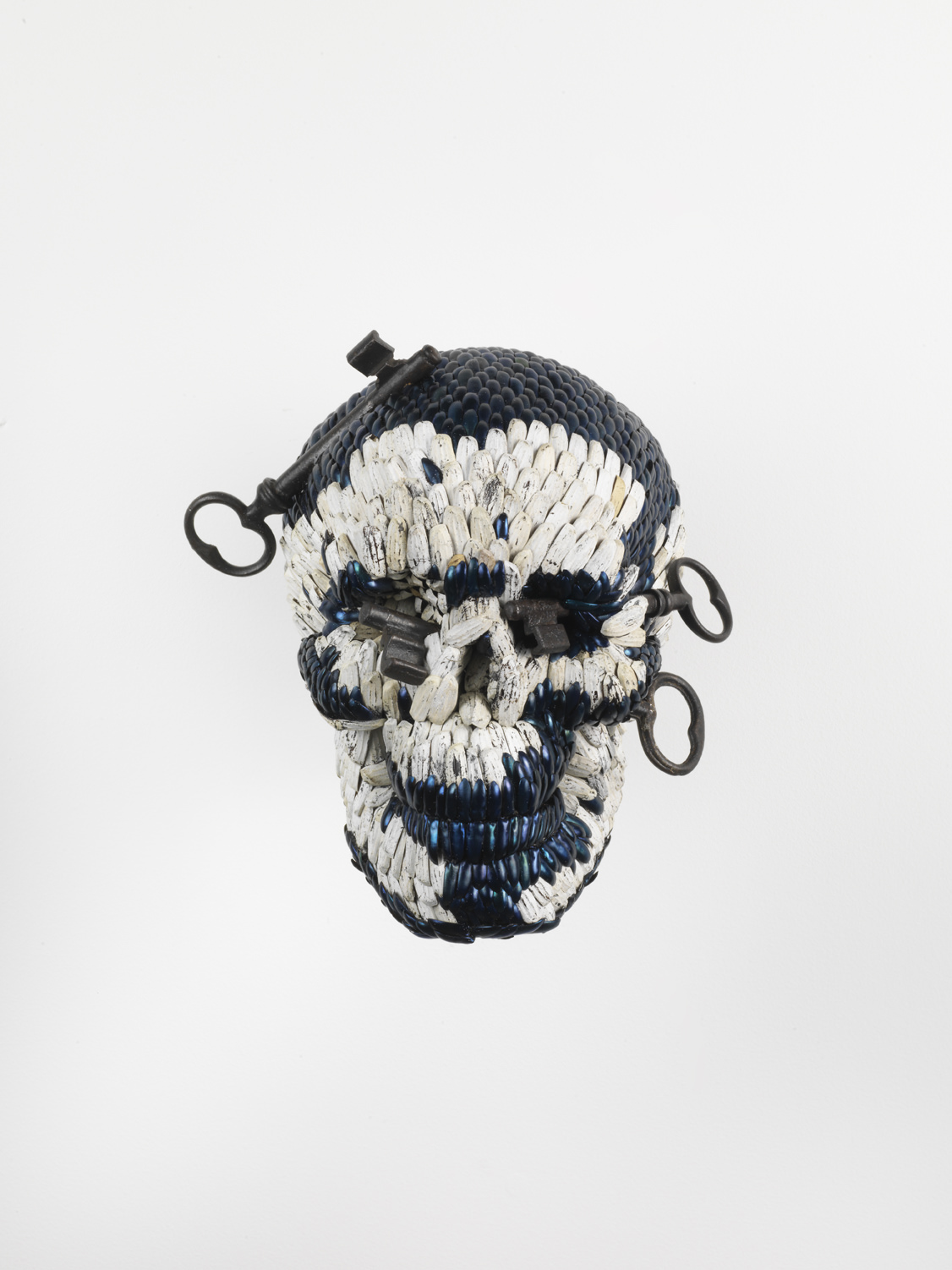 Jan Fabre, Skull with the Keys of Hell, 2013, Mixture of jewel beetle wing-cases, polymers, iron, 23 x 21 x 20cm